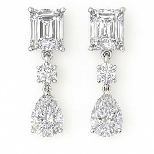 Moissanite Drop Stud Earrings featuring emerald and pear cuts, crafted in white gold-plated 925 silver. Radiant hypoallergenic design. Available at BSI Jewelry.
