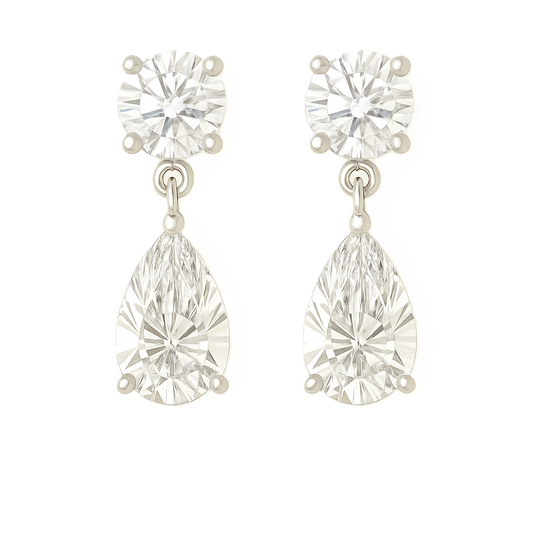 Moissanite Stud Earrings featuring round brilliant and pear cuts, crafted in white gold-plated 925 silver. Graceful and hypoallergenic. Available at BSI Jewelry