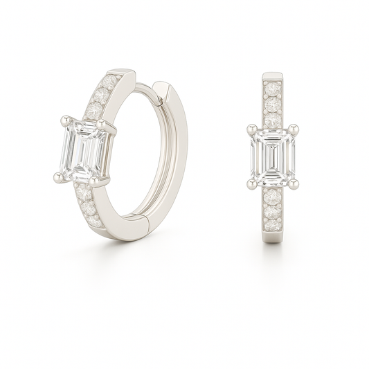 Elegant huggie earrings in white gold-plated 925 silver with a 6×4mm emerald-cut Moissanite for refined brilliance. Available now at BSI Jewelry.