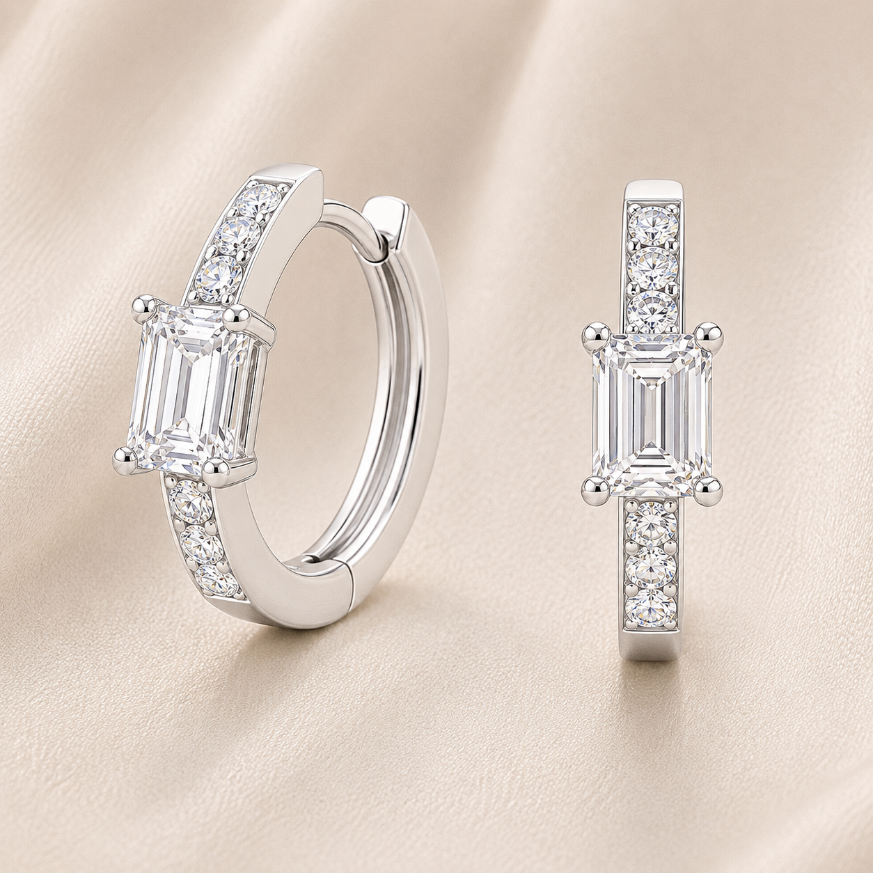 Elegant huggie earrings in white gold-plated 925 silver with a 6×4mm emerald-cut Moissanite for refined brilliance. Available now at BSI Jewelry.