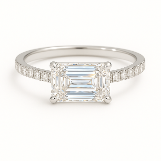 Elegant Moissanite emerald-cut engagement ring in white-gold-plated 925 silver, featuring a 7×5 mm center with pavé band for brilliance. Now at BSI Jewelry.