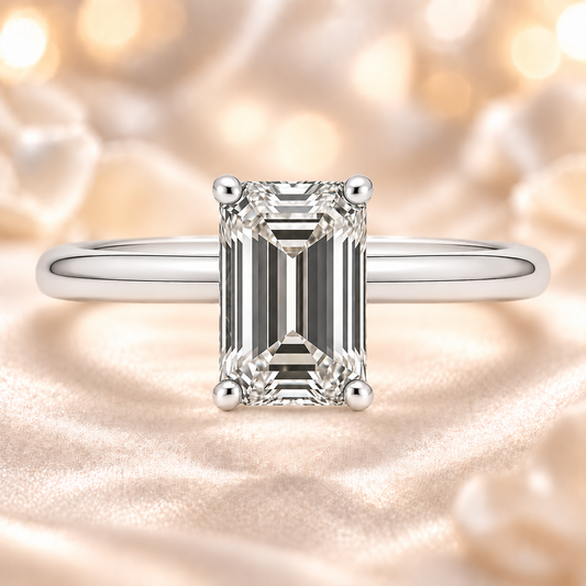 A 7×5 mm emerald-cut Moissanite solitaire in white gold-plated 925 silver with palladium alloy—brilliant, elegant, and hypoallergenic. Available at BSI Jewelry.