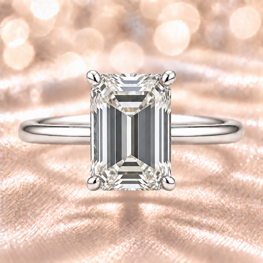 An 8×6 mm emerald-cut Moissanite solitaire in white gold-plated 925 silver with palladium alloy brilliant, elegant, and hypoallergenic. Available at BSI Jewelry.