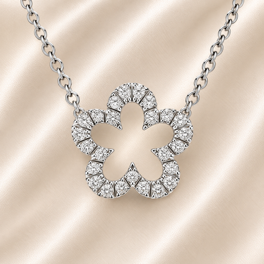 Charming Moissanite flower necklace in 925 silver with a sparkling pavé halo. A feminine and timeless piece symbolizing beauty and grace. Available now at BSI Jewelry.