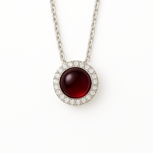 Radiant garnet cabochon pendant accented with Moissanite in 925 silver. 6mm gem, hypoallergenic, and timeless fiery elegance. Available now at BSI Jewelry.