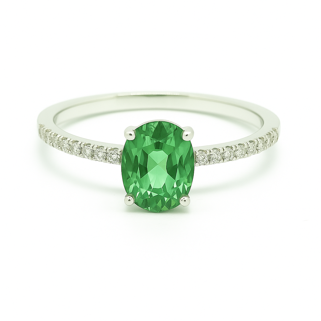 Radiant 7×5 mm green sapphire oval engagement ring accented with Moissanite, in white gold-plated 925 silver and palladium alloy. Available now at BSI Jewelry.