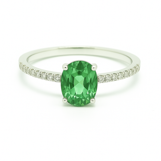 Radiant 7×5 mm green sapphire oval engagement ring accented with Moissanite, in white gold-plated 925 silver and palladium alloy. Available now at BSI Jewelry.