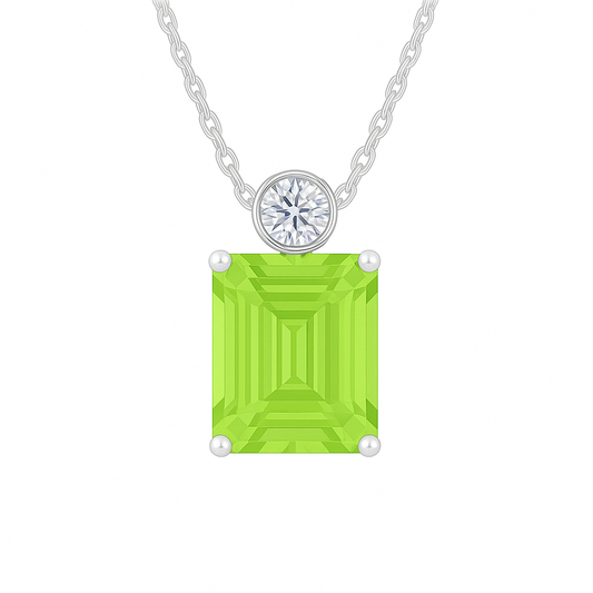 Green sapphire & Moissanite pendant with 7×5 mm emerald-cut stone in white gold-plated 925 silver. Elegant sparkle and hypoallergenic. Available at BSI Jewelry.