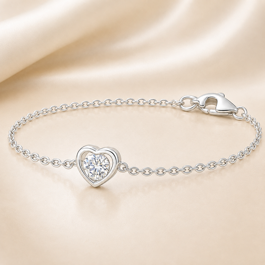 Moissanite heart bracelet with 3 mm round stone, crafted in white-gold-plated 925 silver. Timeless sparkle and everyday elegance. Available now at BSI Jewelry.