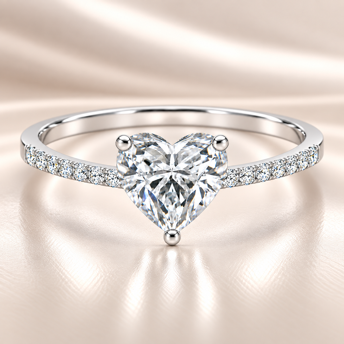Moissanite heart ring with a 6 mm heart-cut stone, accented by moissanite in white gold-plated 925 silver. Romantic and elegant. Available now at BSI Jewelry.