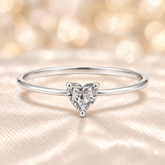 Dainty 5mm heart-cut Moissanite solitaire in white gold-plated 925 silver with palladium-added alloy. Elegant, radiant, and hypoallergenic. Now at BSI Jewelry.