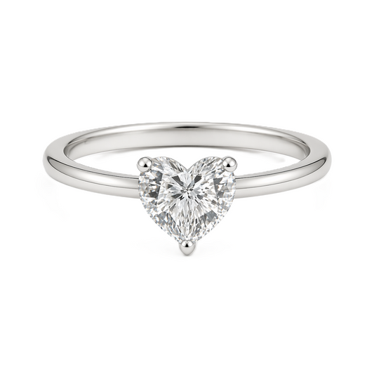 7mm heart-cut Moissanite solitaire in white gold-plated 925 silver with palladium-added alloy. Radiant, elegant, and hypoallergenic. Available now at BSI Jewelry.