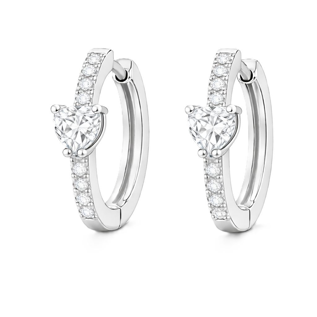 Moissanite huggie earrings featuring a 5 mm heart stone in white gold-plated 925 silver. Elegant sparkle with pavé accents. Available now at BSI Jewelry.