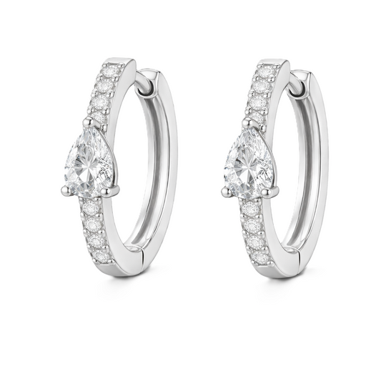 Moissanite huggie earrings, 5×3 mm pear cut in white gold plated 925 silver. Elegant pavé hoop design with brilliant sparkle. Available now at BSI Jewelry.