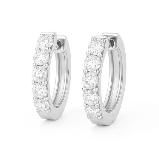 2.5 mm round Moissanite huggies in white gold-plated 925 silver. Brilliant sparkle, hypoallergenic, safe for daily wear. Available now at BSI Jewelry.