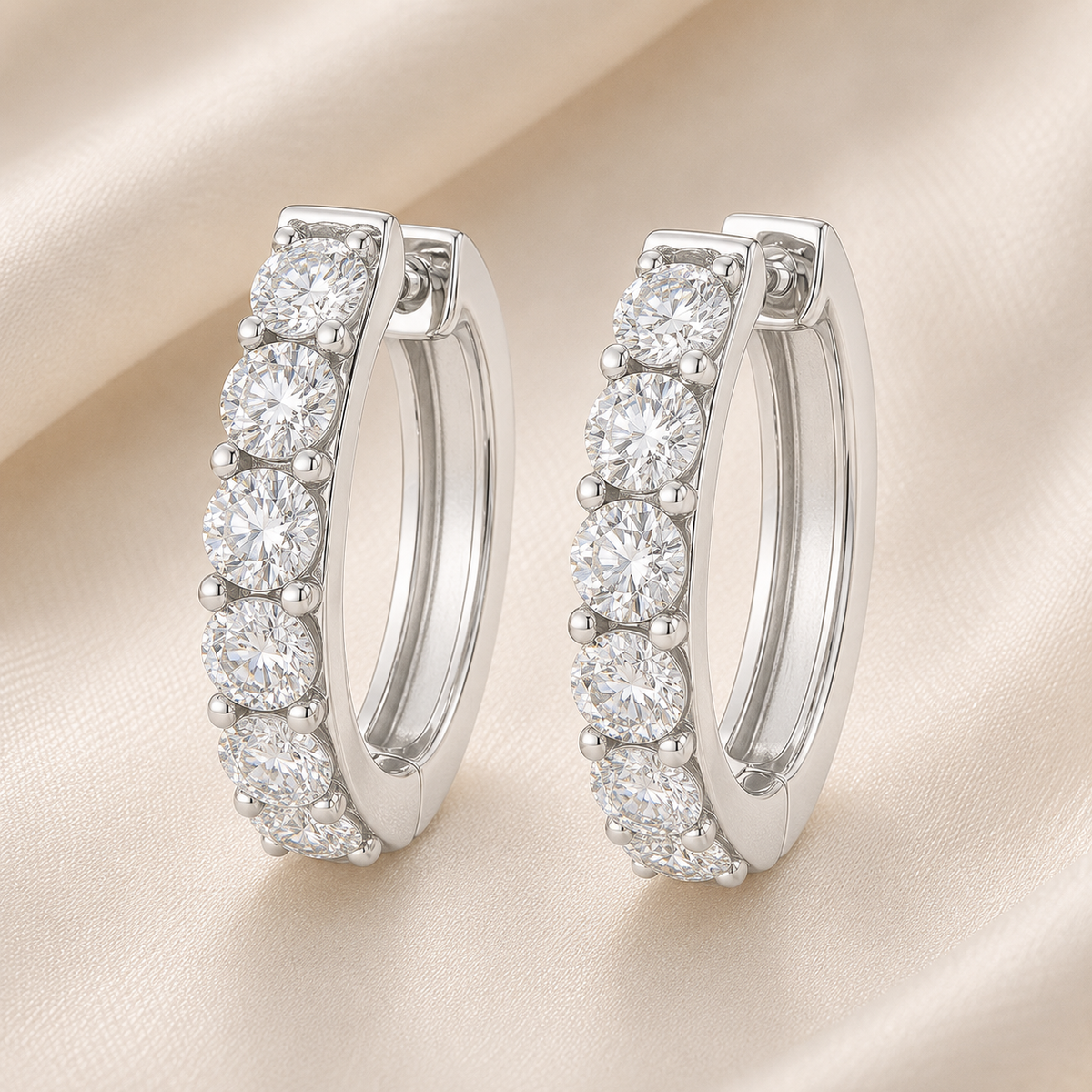 2.5 mm round Moissanite huggies in white gold-plated 925 silver. Brilliant sparkle, hypoallergenic, safe for daily wear. Available now at BSI Jewelry.