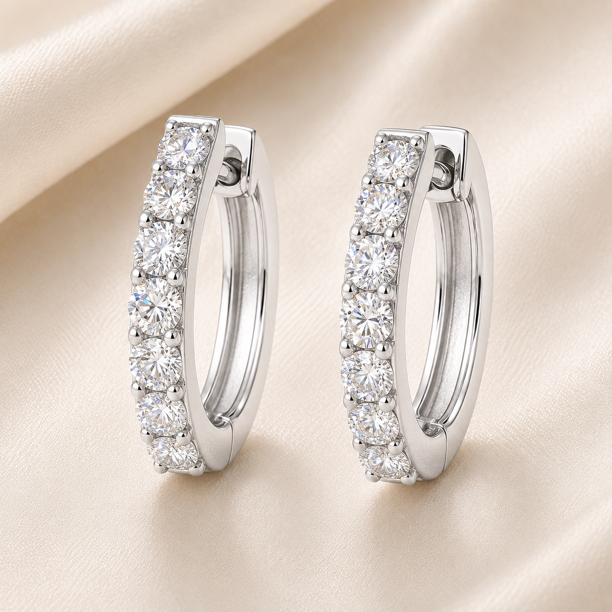 2 mm round Moissanite huggies in white gold-plated 925 silver. Bright sparkle, hypoallergenic, perfect and safe for daily wear. Available now at BSI Jewelry.