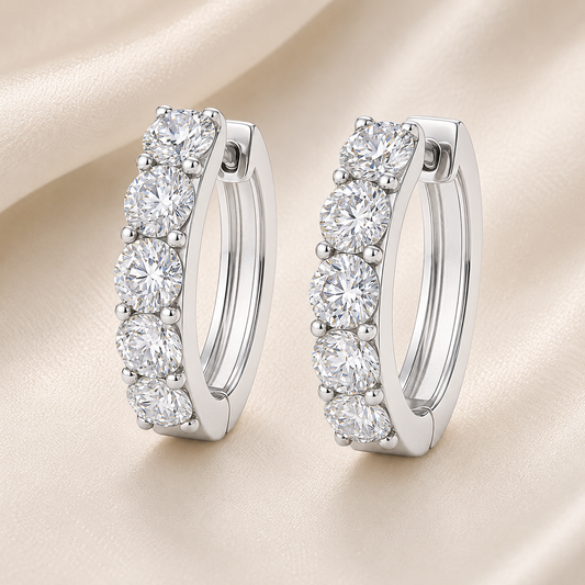 3.5 mm round Moissanite huggies in white gold-plated 925 silver. Design is bold sparkle, hypoallergenic and safe for daily wear. Available now at BSI Jewelry.