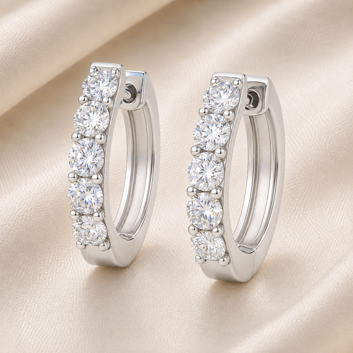 3 mm round Moissanite huggies in white gold-plated 925 silver. Five-stone design, sparkling, hypoallergenic and safe for daily wear. Available now at BSI Jewelry.