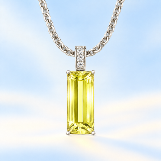 Moissanite and lemon quartz pendant with a 14 × 6 mm baguette-cut gemstone in white gold-plated 925 silver. Fresh and elegant. Available now at BSI Jewelry.