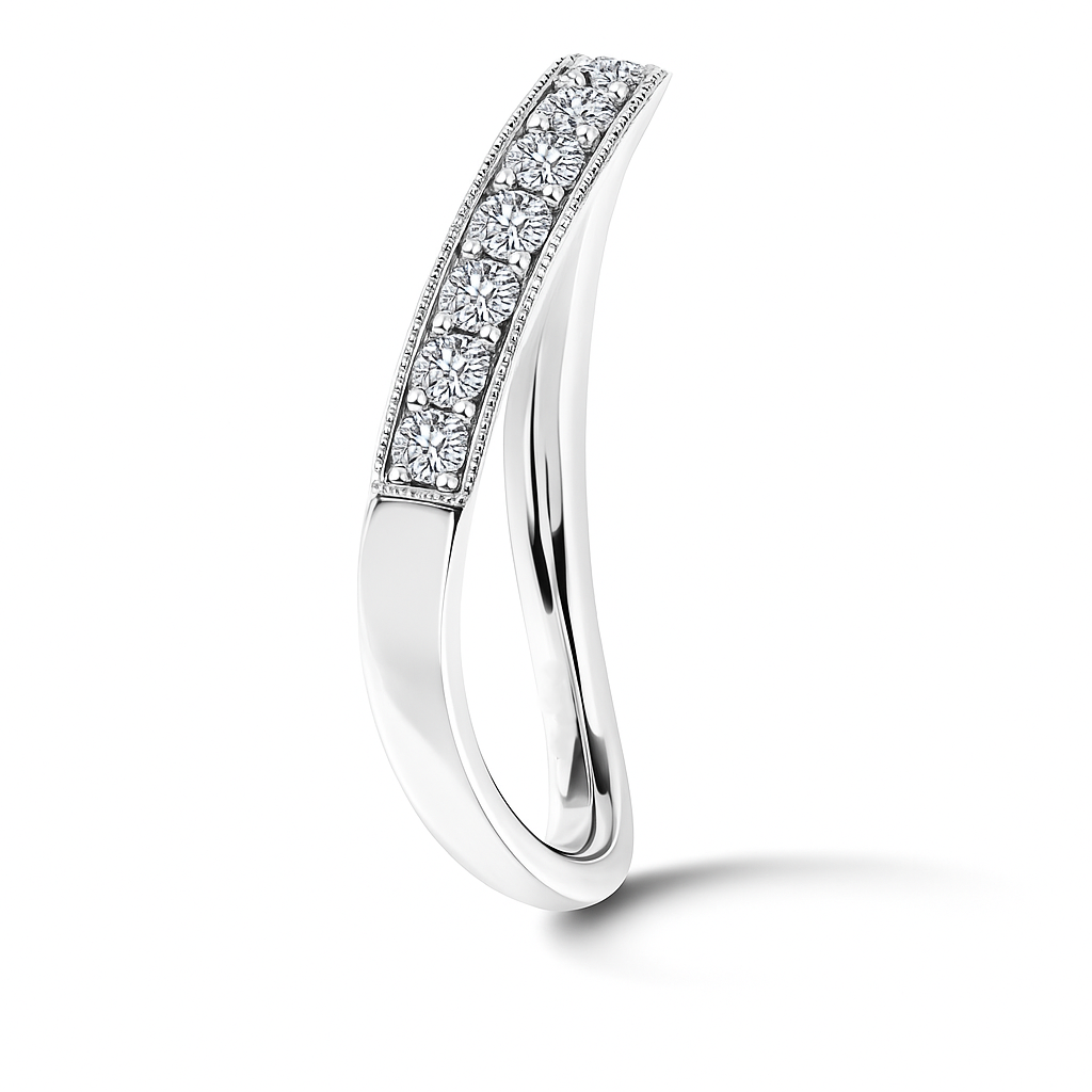 Vintage-inspired Moissanite curved wedding band in 925 silver with milgrain detail. Finely crafted, hypoallergenic, and timelessly elegant. Now at BSI Jewelry.