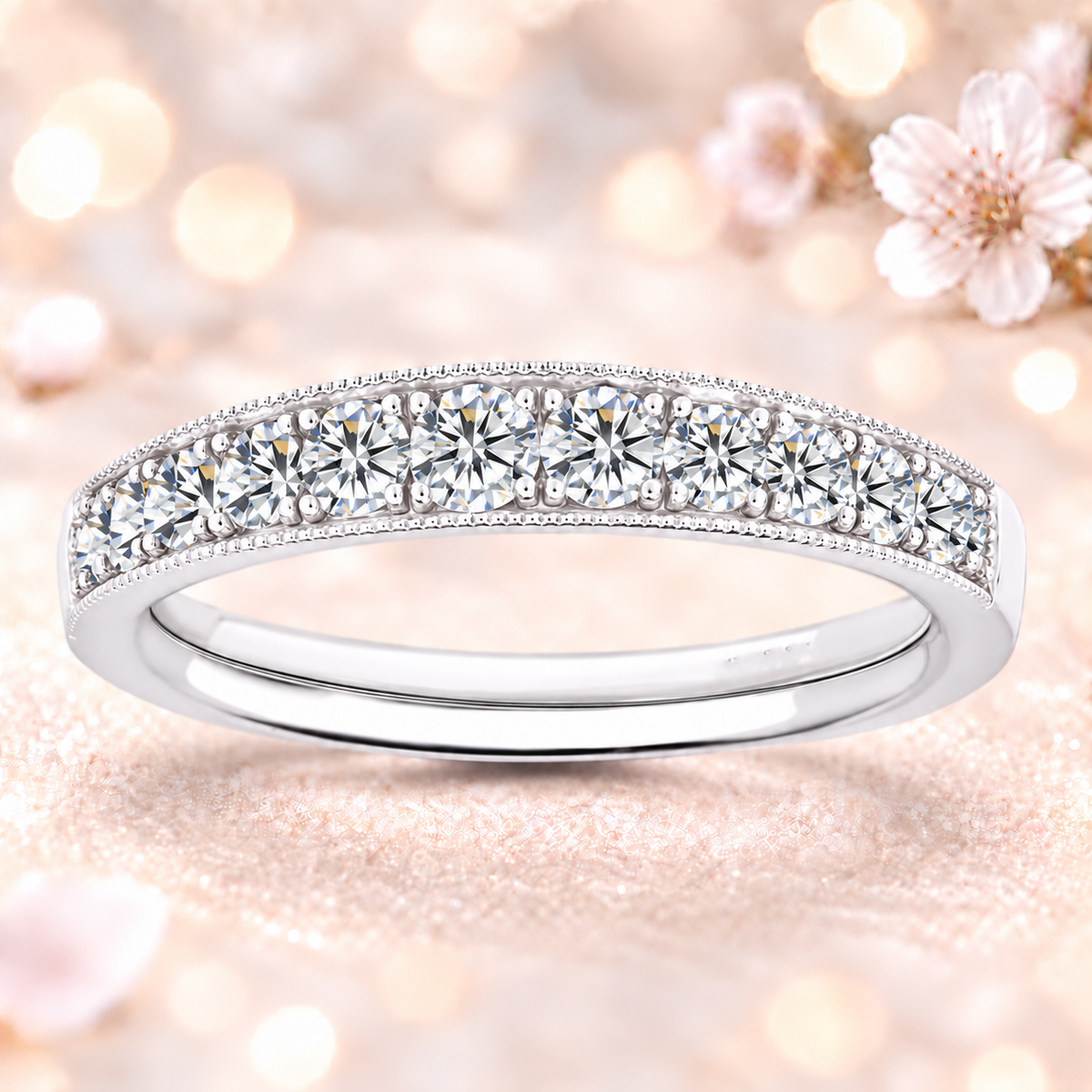 A radiant 1.00 carat Moissanite half-eternity wedding band with delicate milgrain edges, crafted in white-gold-plated 925 silver for timeless sparkle and charm.