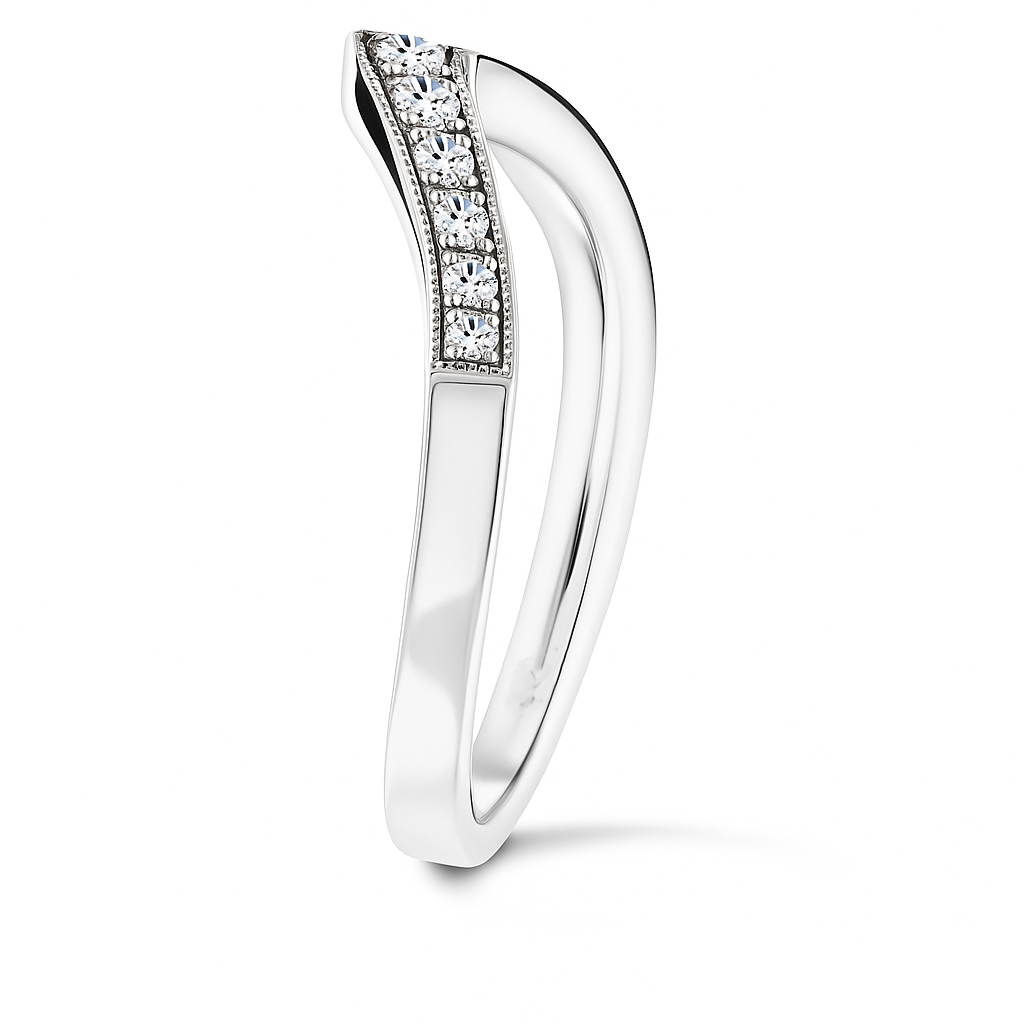 Vintage-inspired Moissanite V-shaped wedding band in 925 silver with milgrain detail. Channel-set brilliance and timeless elegance. Available at BSI Jewelry.