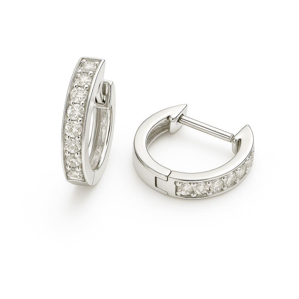 Elegant Moissanite pavé huggie earrings in white gold-plated 925 silver with palladium alloy. Radiant and hypoallergenic, safe to wear. Available at BSI Jewelry.