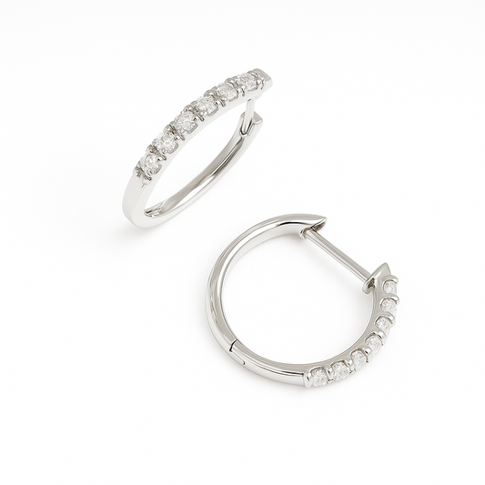 Elegant Moissanite pavé huggie earrings in 925 silver. Single-row brilliance, hypoallergenic comfort, and timeless sparkle for daily wear. Now at BSI Jewelry.
