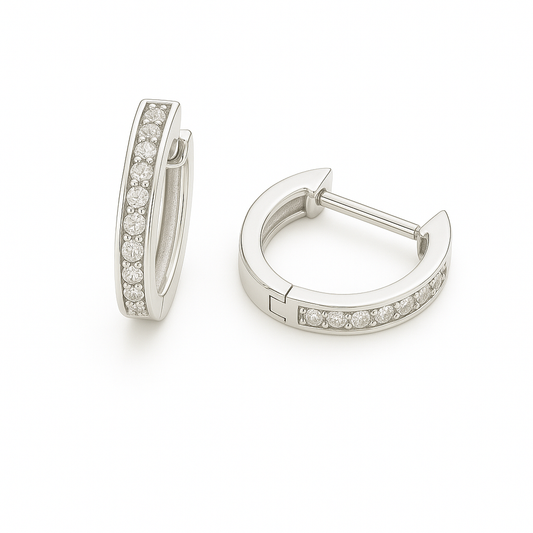 1.5 mm moissanite pave set huggies earrings in white gold-plated 925 silver. Sleek, refined and hypoallergenic for daily wear. Available now at BSI Jewelry.