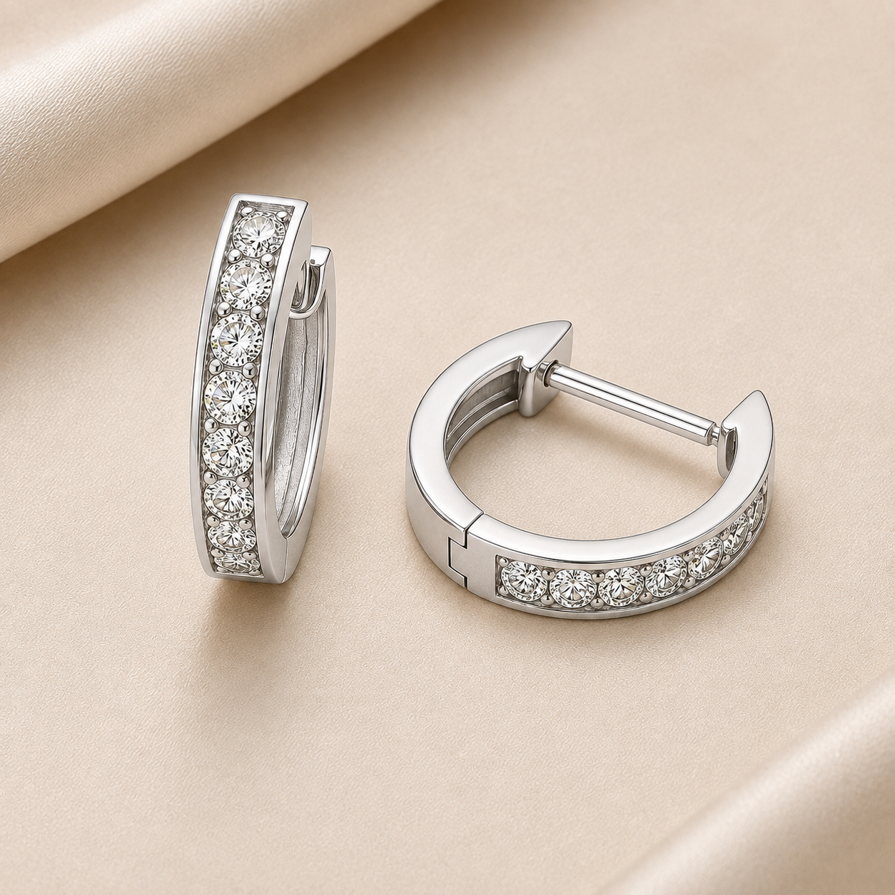 2 mm moissanite pave set huggies earrings in white gold-plated 925 silver. Sleek, refined and hypoallergenic for daily wear. Available now at BSI Jewelry.
