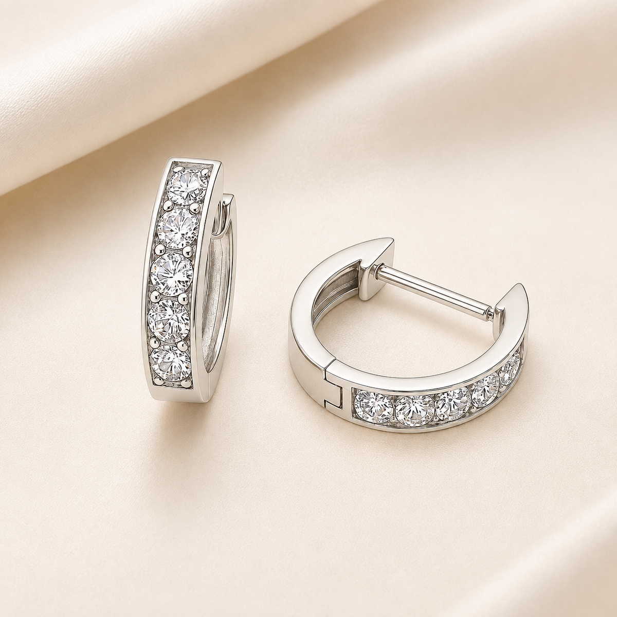 3.5 mm moissanite pave set huggies earring in white gold-plated 925 silver. Sleek, refined and hypoallergenic for daily wear. Available now at BSI Jewelry.
