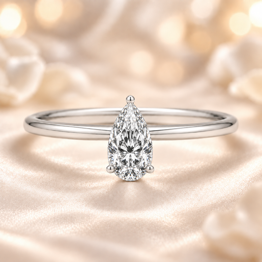 5x3mm pear Moissanite solitaire in white gold-plated 925 silver with a palladium-added alloy—elegant, radiant, and hypoallergenic. Available now at BSI Jewelry.