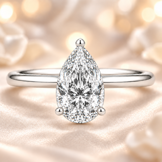 7x5mm pear Moissanite solitaire in white gold-plated 925 silver with a palladium-added alloy—elegant, radiant, and hypoallergenic. Available now at BSI Jewelry.