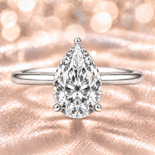 9x7mm pear Moissanite solitaire in white gold-plated 925 silver with a palladium-added alloy—elegant, radiant, and hypoallergenic. Available now at BSI Jewelry.