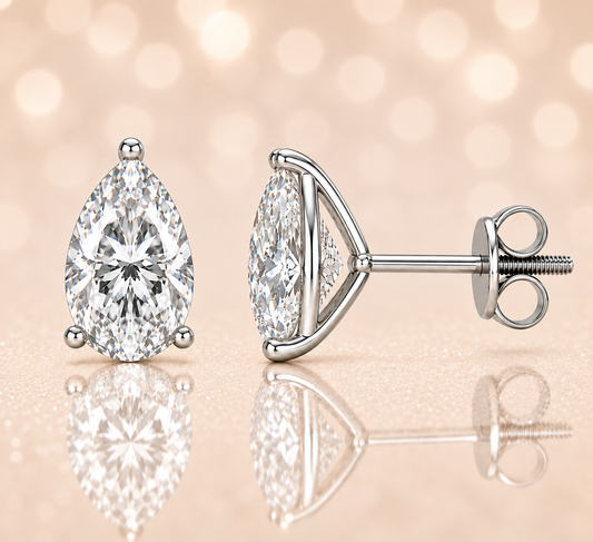 Pear-cut Moissanite stud earrings in white gold-plated 925 silver with palladium alloy and screw-back posts. Secure and safe to wear. Available at BSI Jewelry.