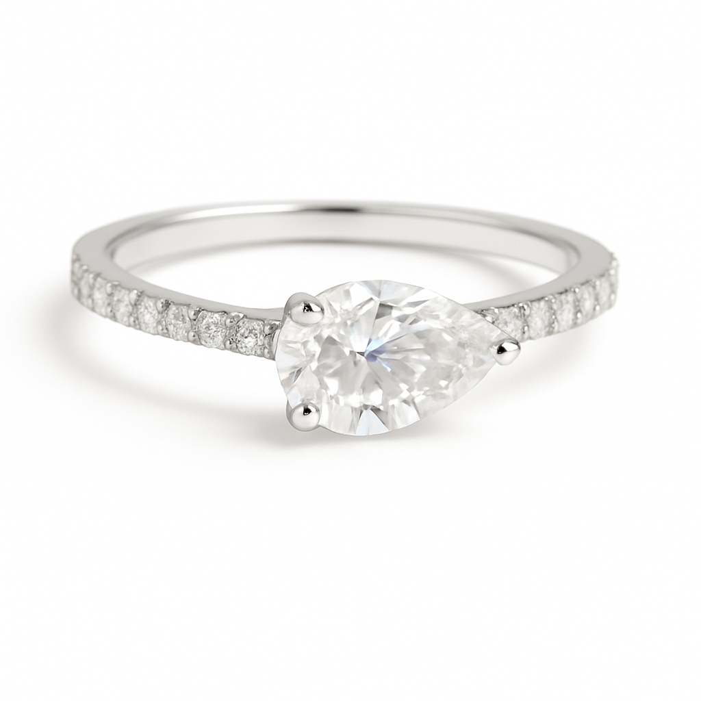 Graceful Moissanite pear-cut engagement ring in 925 silver, featuring a 7×5 mm stone with pavé band for brilliance and timeless charm. Now at BSI Jewelry.