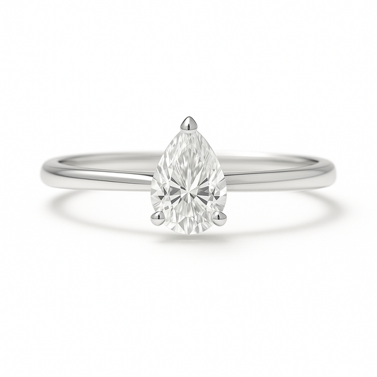 Elegant Moissanite pear solitaire ring with 6×4 mm pear in white gold-plated 925 silver. Radiant sparkle with hypoallergenic comfort. Available at BSI Jewelry.