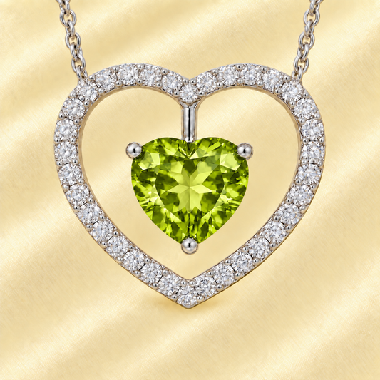 Moissanite and peridot necklace with a 6 mm heart-cut gemstone in white gold-plated 925 silver. Fresh and elegant. Available now at BSI Jewelry.