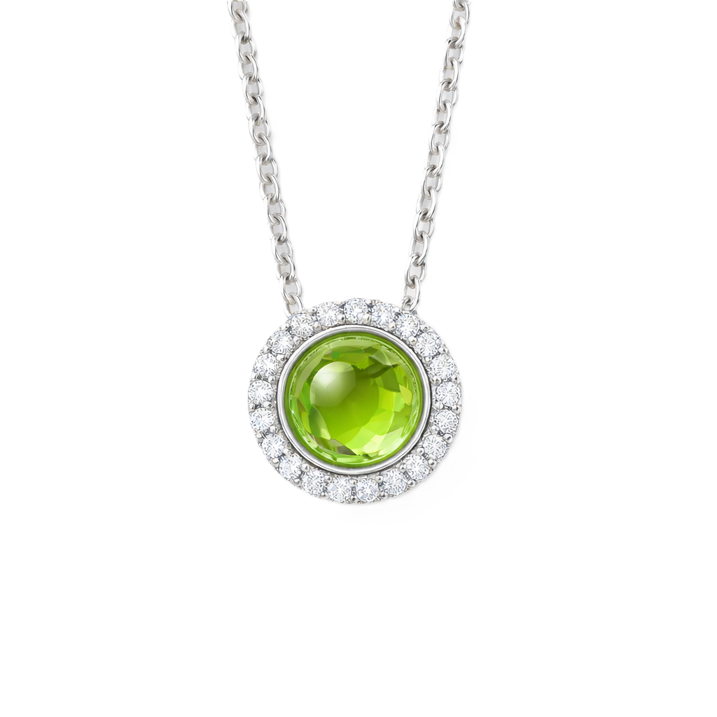 Moissanite and peridot pendant with a 6 mm cabochon gemstone in white gold-plated 925 silver. Fresh and elegant. Available now at BSI Jewelry.