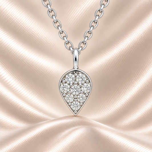 Delicate Moissanite teardrop pendant in 925 silver with sparkle. Hypoallergenic and refined, perfect for daily elegance or gifting. Available at BSI Jewelry.