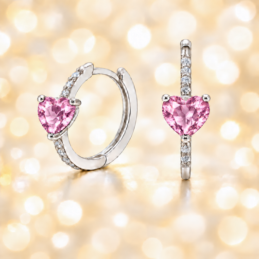 Elegant heart-cut pink amethyst huggie earrings in white gold-plated 925 silver with sparkling Moissanite accents for soft rosy charm. Available at BSI Jewelry.