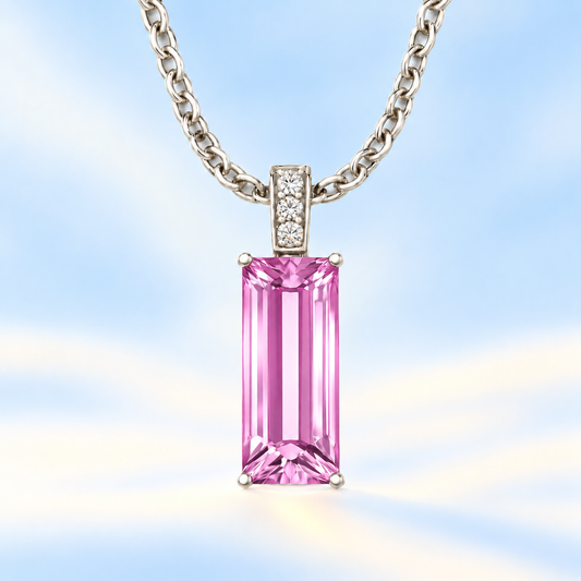 Moissanite and pink amethyst pendant with a 14 × 6 mm baguette-cut gemstone in white gold-plated 925 silver. Soft and elegant. Available now at BSI Jewelry.
