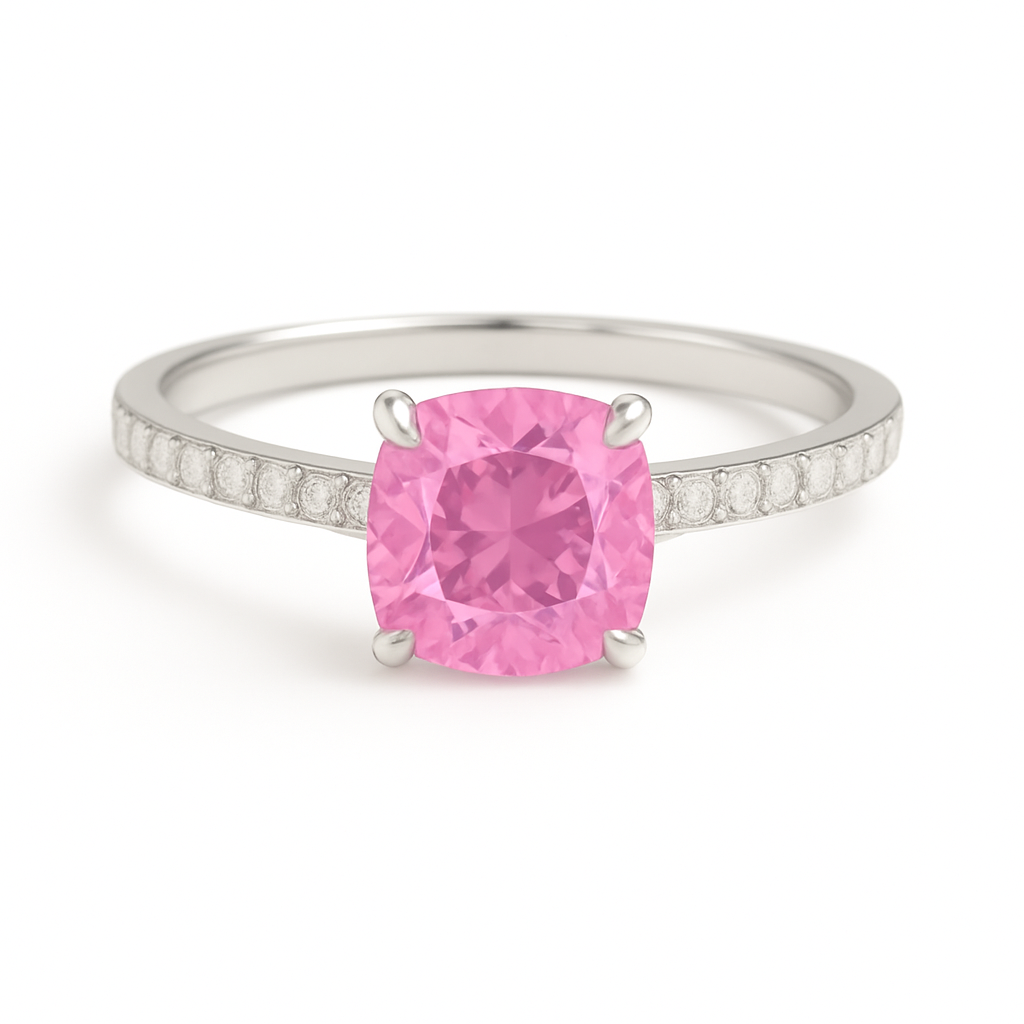 Elegant 7 mm cushion pink sapphire ring accented with Moissanite, crafted in white gold-plated 925 silver with palladium alloy. Available now at BSI Jewelry.