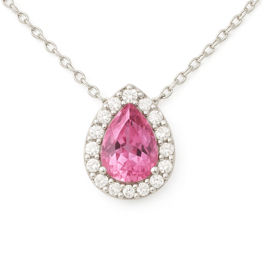 Elegant 7×5 mm pink sapphire halo necklace accented with Moissanite, crafted in white gold-plated 925 silver and palladium alloy. Available now at BSI Jewelry.