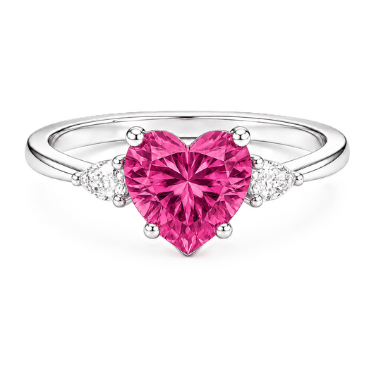 6 mm heart-cut pink sapphire ring with pear-shaped Moissanite accents, set in white-gold-plated 925 silver. Romantic and charming. Available now at BSI Jewelry.