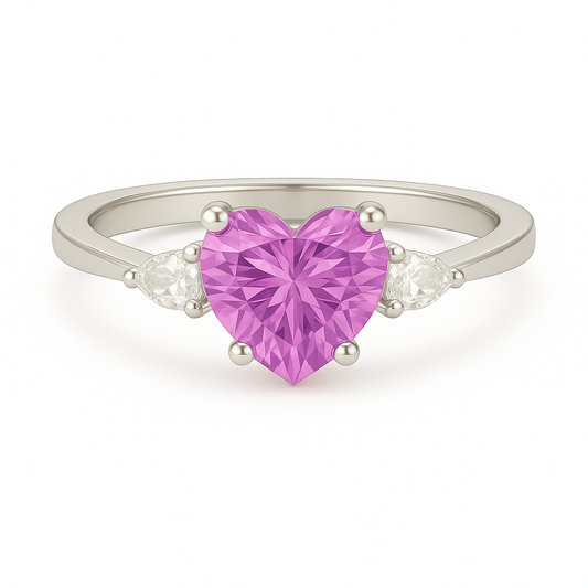 6 mm heart-cut pink sapphire ring with pear-shaped Moissanite accents, set in white-gold-plated 925 silver. Romantic and charming. Available now at BSI Jewelry.