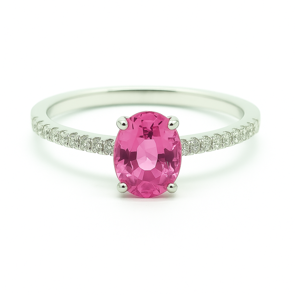 Radiant 7×5 mm pink sapphire oval engagement ring accented with Moissanite, in white gold-plated 925 silver and palladium alloy. Available now at BSI Jewelry.