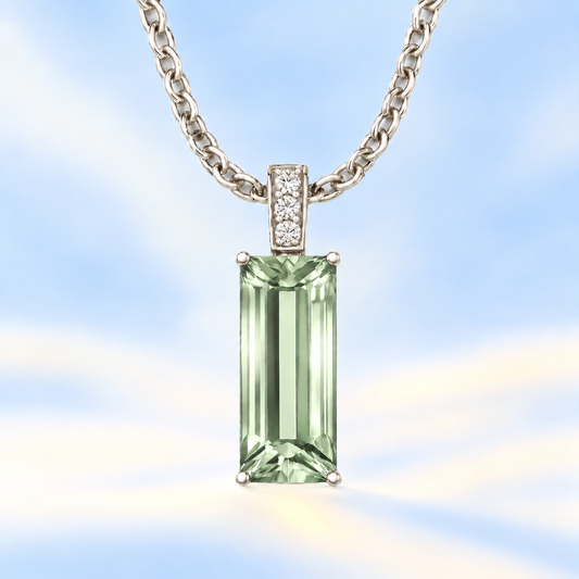 Moissanite and prasolite pendant with a 14 × 6 mm baguette-cut gemstone in white gold-plated 925 silver. Calm and elegant. Available now at BSI Jewelry.