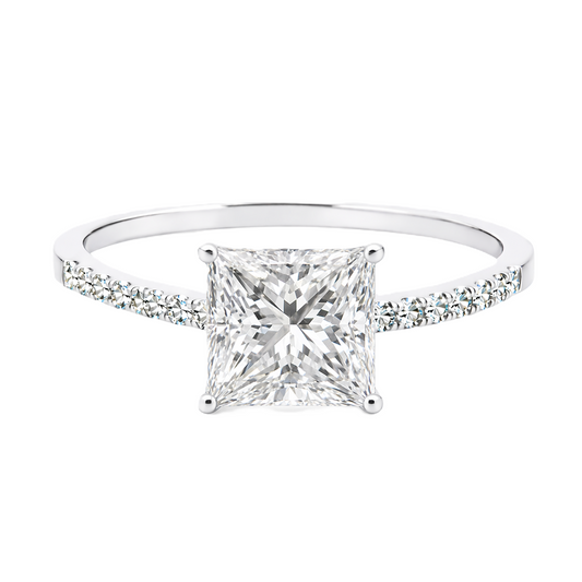 Moissanite princess ring with a 6 mm princess-cut stone, accented by moissanite in white gold-plated 925 silver. Modern and elegant. Available now at BSI Jewelry.
